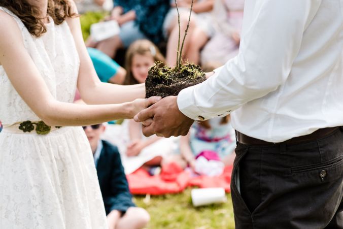 bride and groom plant a tree